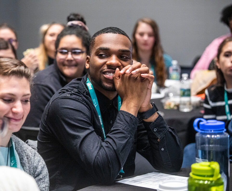 young student smiling during NextGen