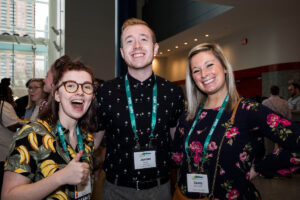 three ACPA members smiling and giving thumbs up