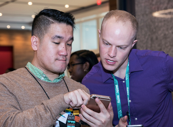 Two ACPA members looking at a phone