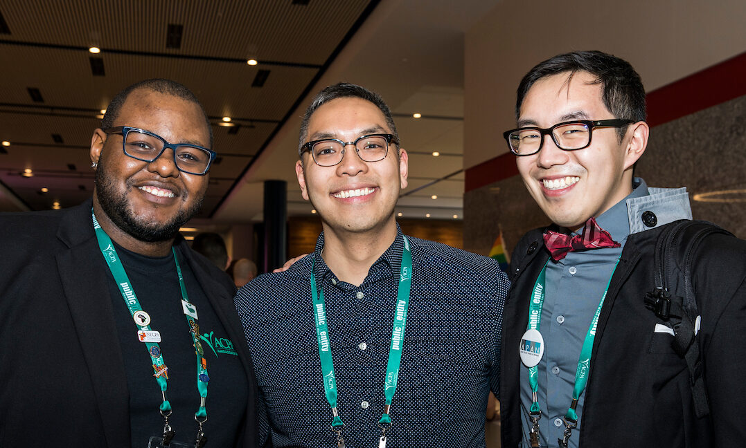 three ACPA members smiling and giving thumbs up