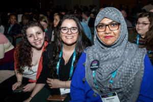 three members at ACPA smiling at the camera