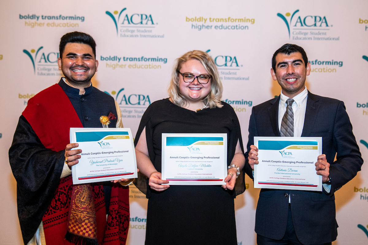 photo of three ACPA mebers receiving an award