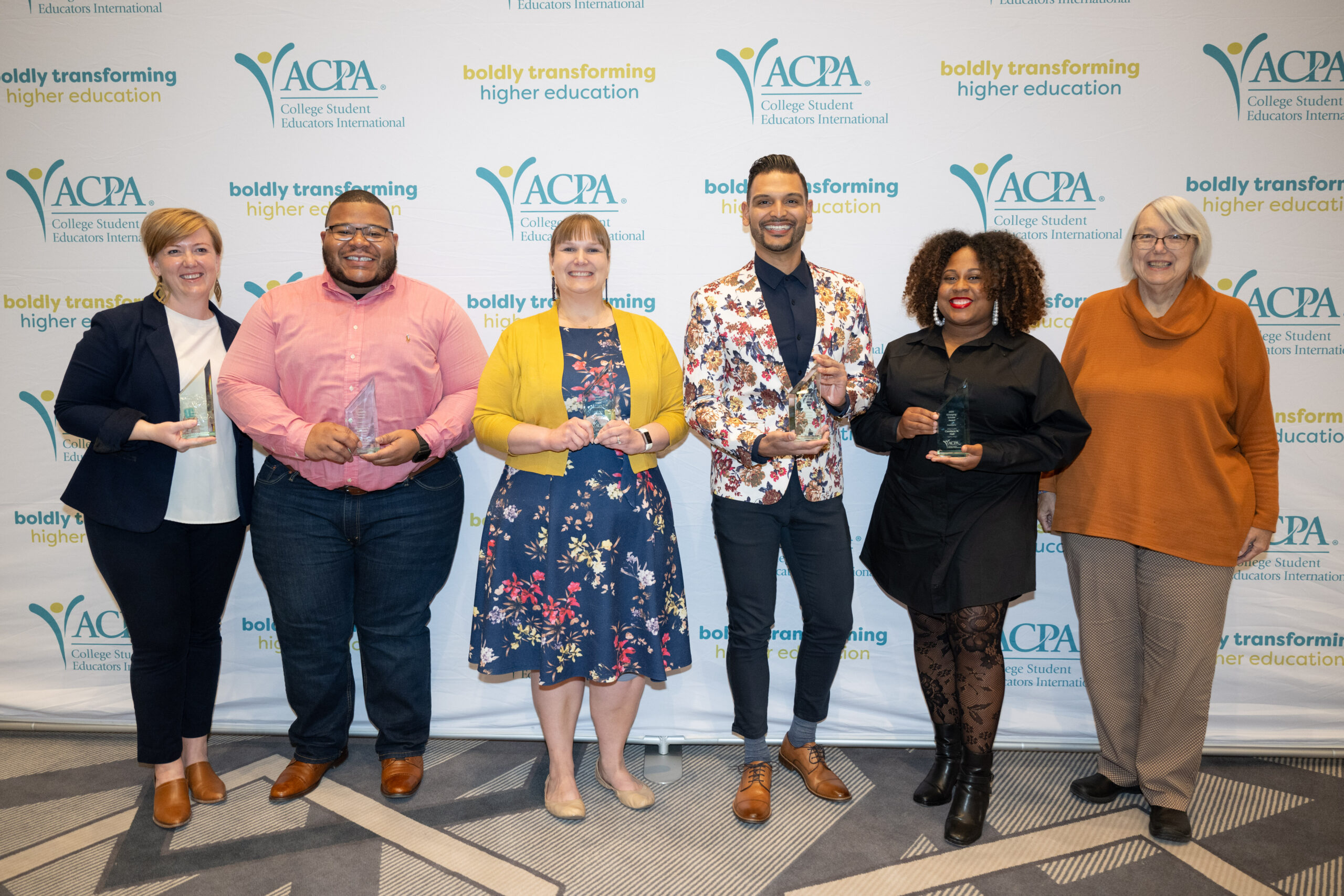 photo of all 2020 emerging scholars holding their awards at ACPA20